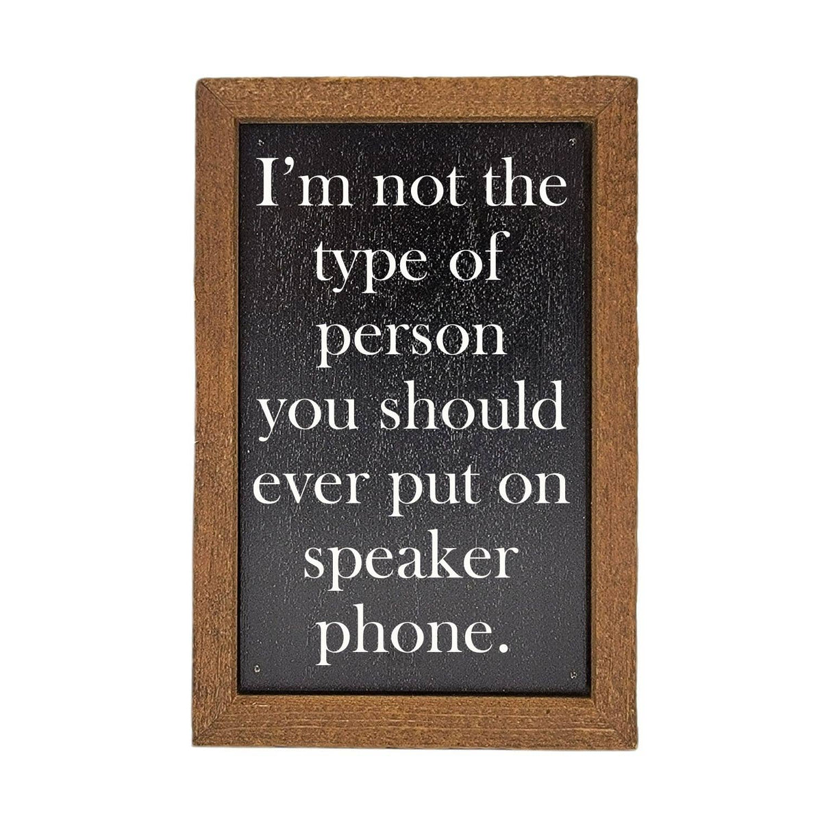 Small wooden sign with humorous text on a white background