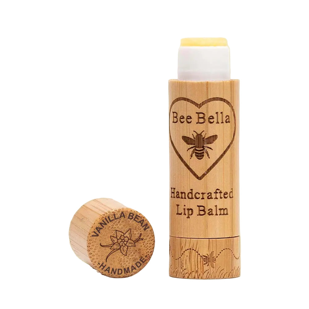 Bee Bella lip balm with wooden container on a white background