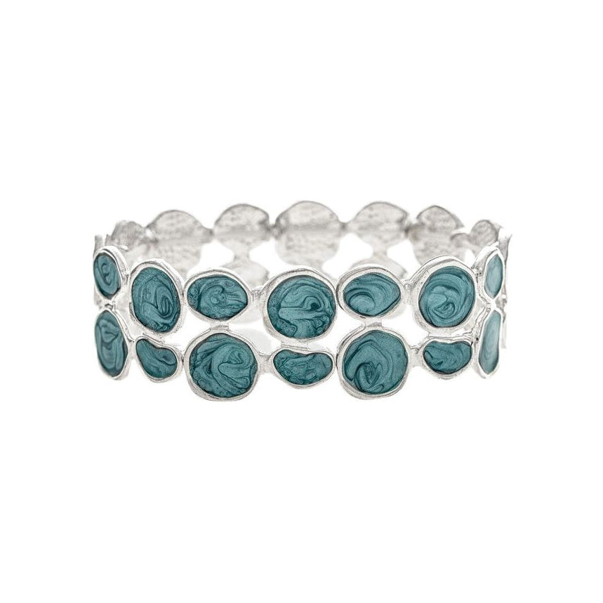 A silver stretch band bracelet featuring a row of oval-cut teal blue-green gemstones, set against a plain white background.